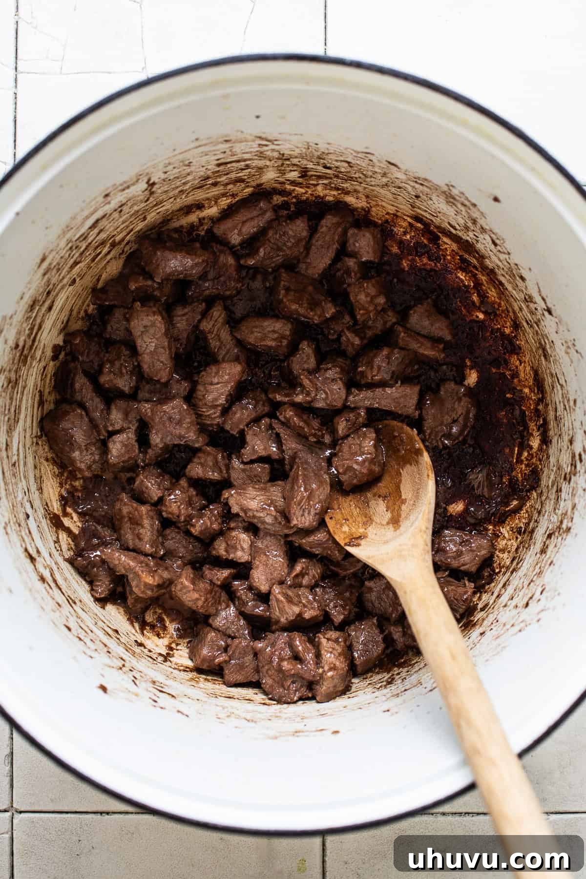 Beef browned in a pot for making chile colorado.