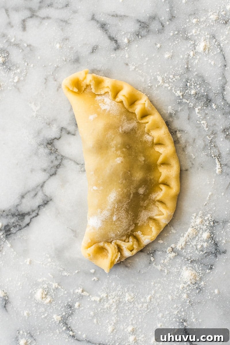 Sweet Apple Hand Pies 6 Baked Apple Empanadas are the perfect dessert for the fall and winter seasons! They're portable, delicious and super addicting.