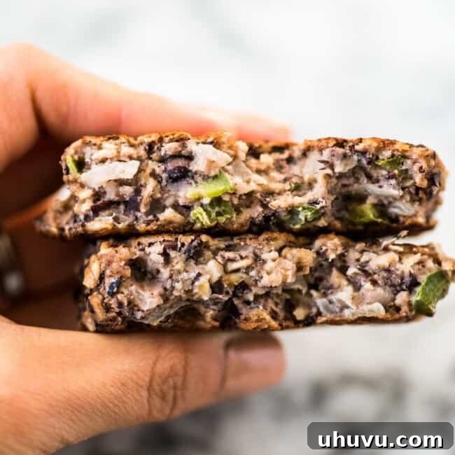 Crispy black bean patties served with a side of fresh cilantro yogurt sauce, perfect as vegetarian burgers.