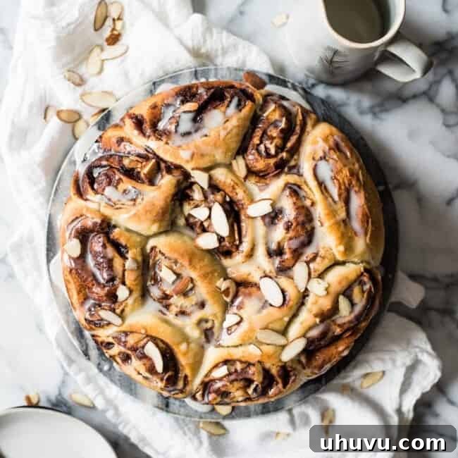 A rustic shot of a Mexican Chocolate Cinnamon Roll on a plate, ready to be enjoyed.