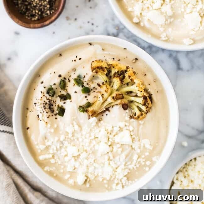 This Roasted Cauliflower Soup with Fried Jalapeños is thick, creamy and loaded with healthy veggies. It's also gluten free, paleo, vegetarian and vegan!