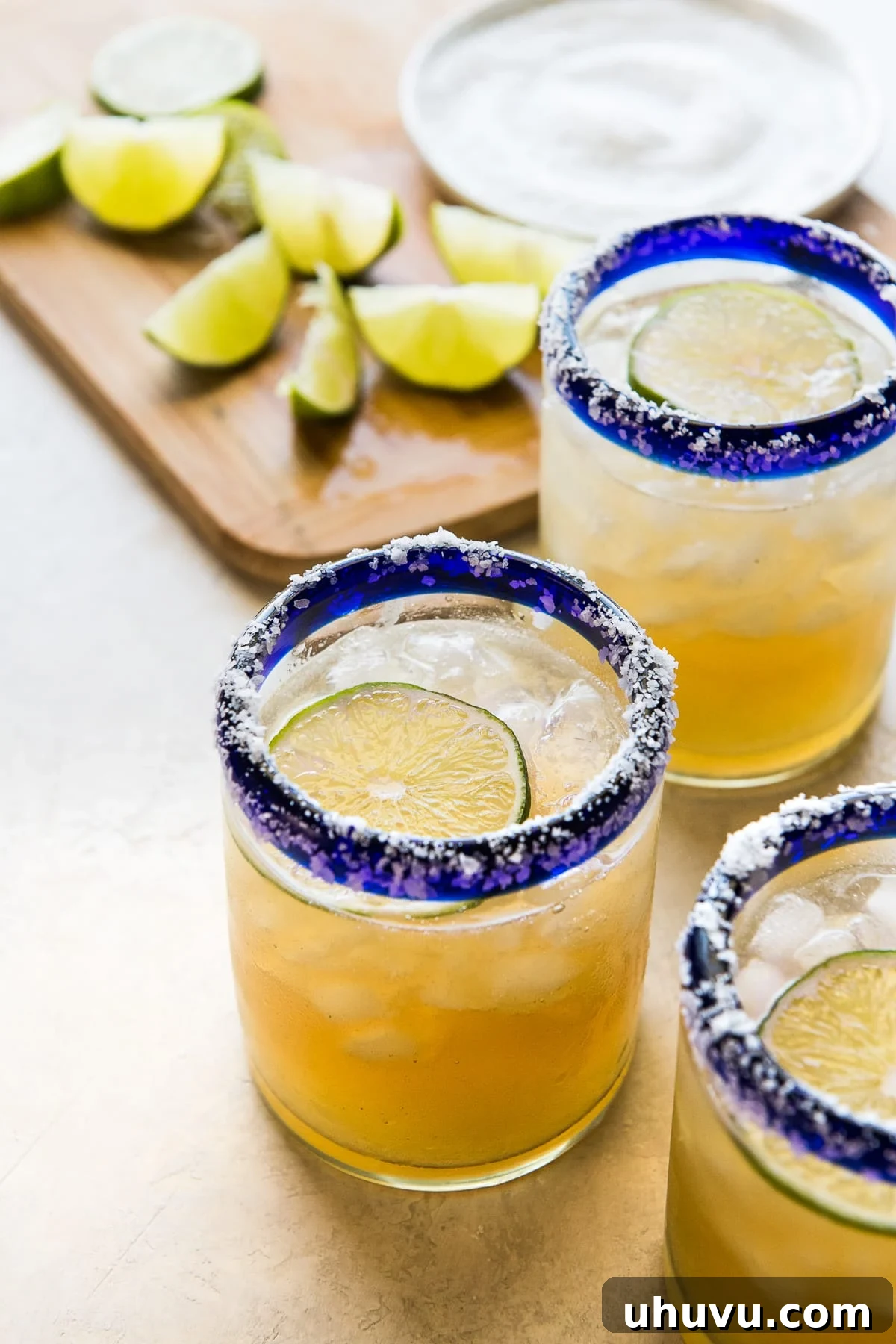 Crafting the Perfect Margarita 2 A classic margarita recipe in an iced glass garnished with fresh lime and a salted rim, ready to be enjoyed.