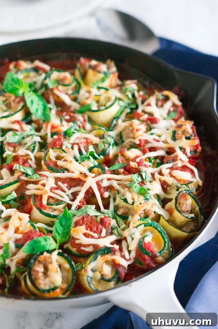 Zucchini Lasagna Roll-Ups with Italian sausage and cheese, topped with marinara sauce, perfect for low-carb and gluten-free diets.
