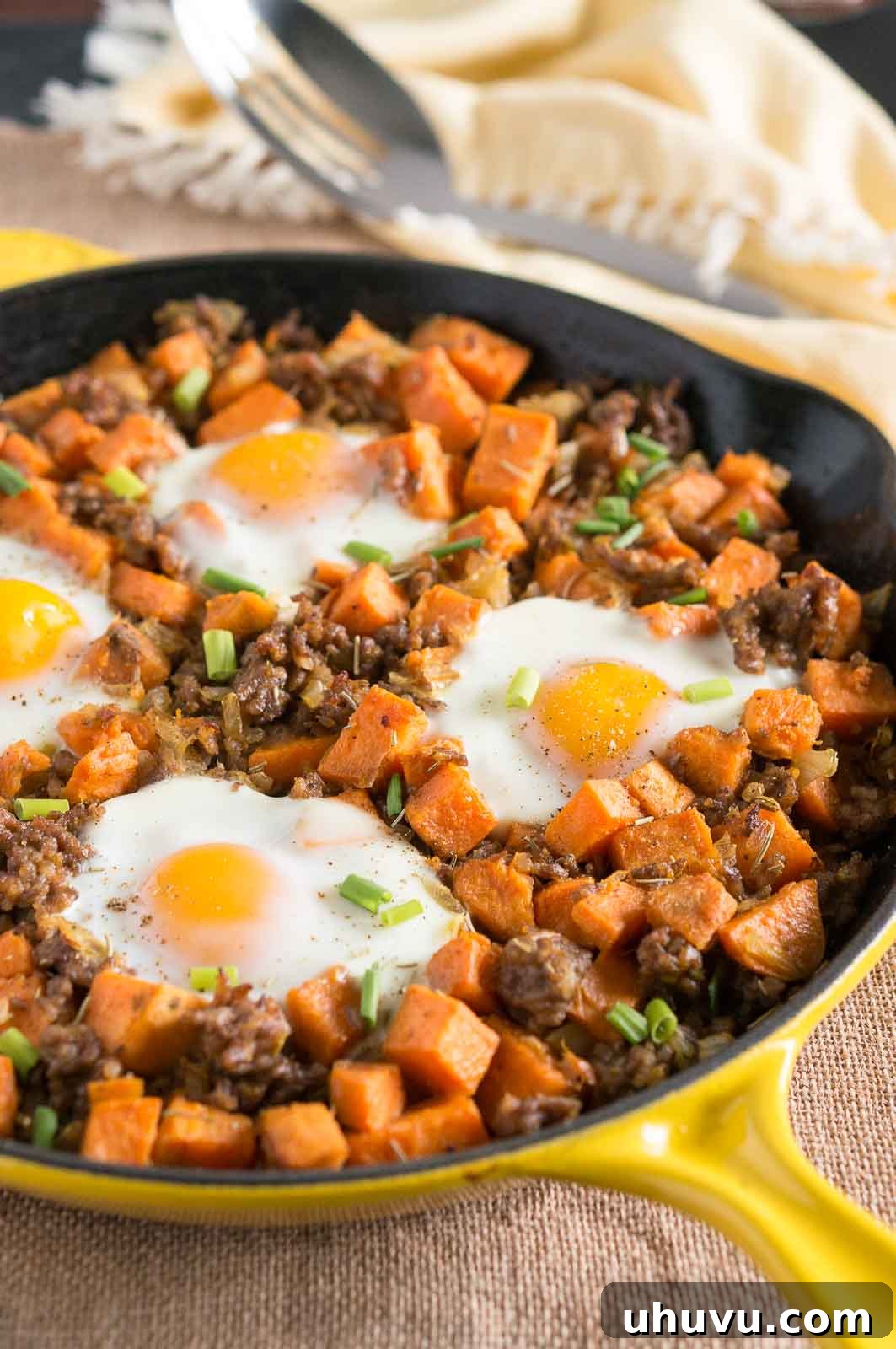 30 Effortless Whole30 Dinners 3 Sweet Potato Hash with Sausage and Eggs, a hearty Whole30 breakfast-for-dinner option.