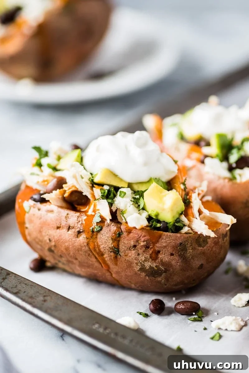 Enchilada Stuffed Sweet Potato Boats 5 Fresh sweet potatoes ready for baking, emphasizing the natural and healthy ingredients of the recipe.