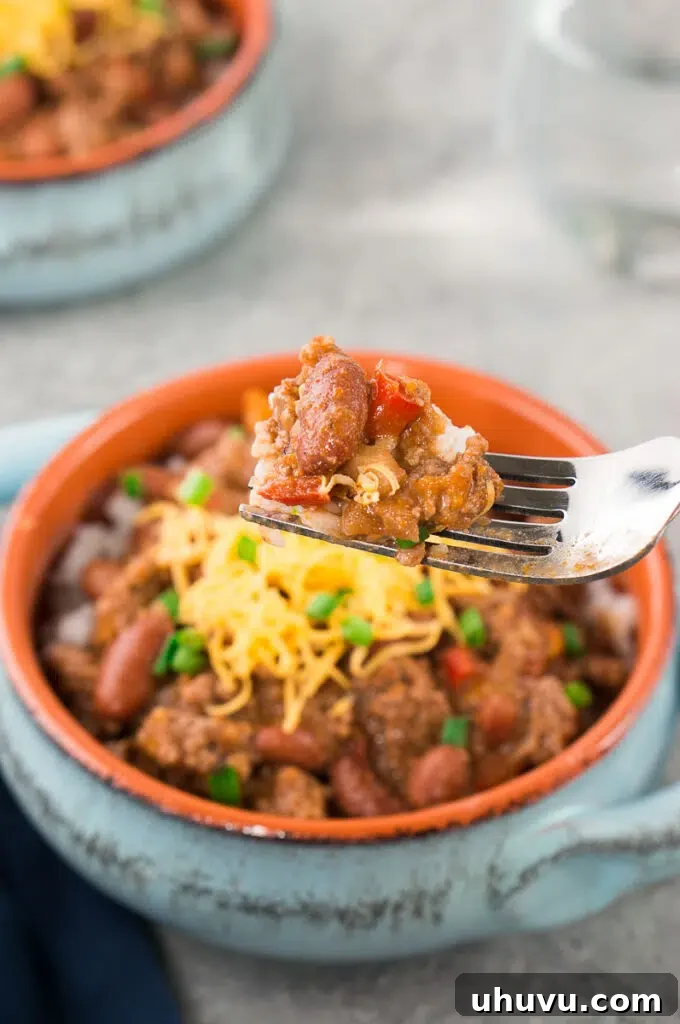 Ultimate Chili Recipe 7 scooping with a fork