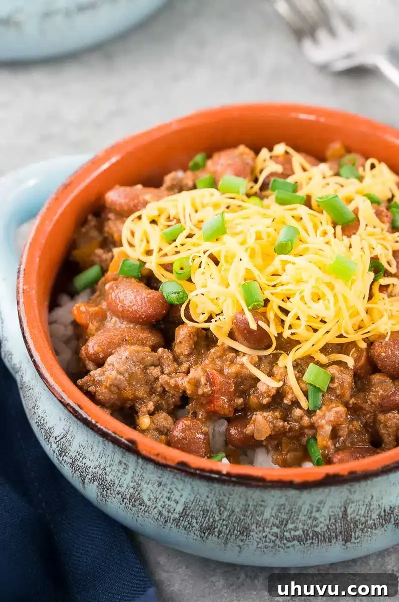 Ultimate Chili Recipe 8 close up of chili recipe with shredded cheese and onions