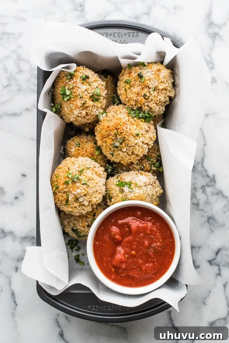 Zesty Fiesta Rice Bites 2 Crispy, golden-baked Mexican arancini rice balls filled with melted mozzarella cheese and coated in crunchy panko breadcrumbs.