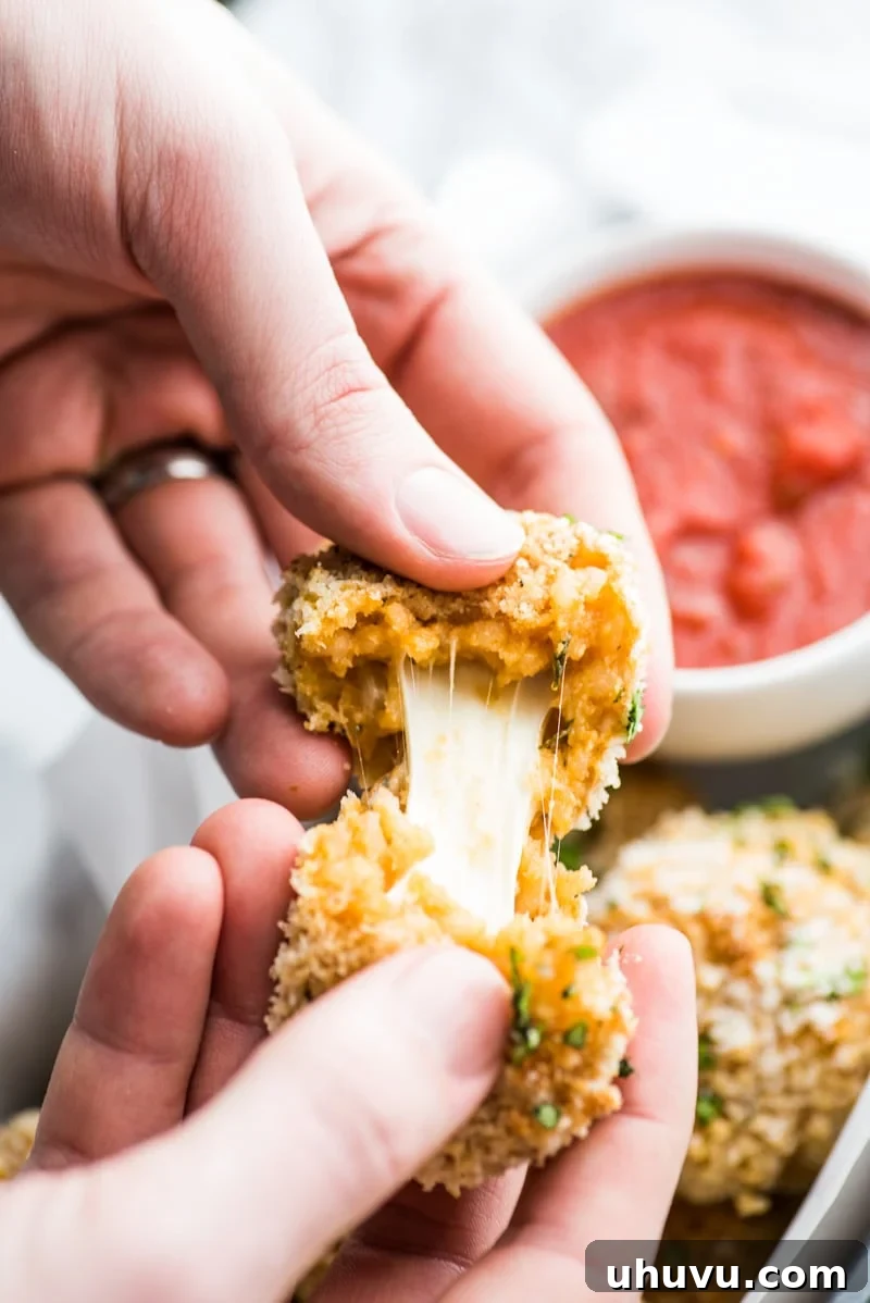Zesty Fiesta Rice Bites 11 Baked arancini balls, filled with Mexican-spiced rice and mozzarella, displaying a crispy panko coating for a healthier, baked option.