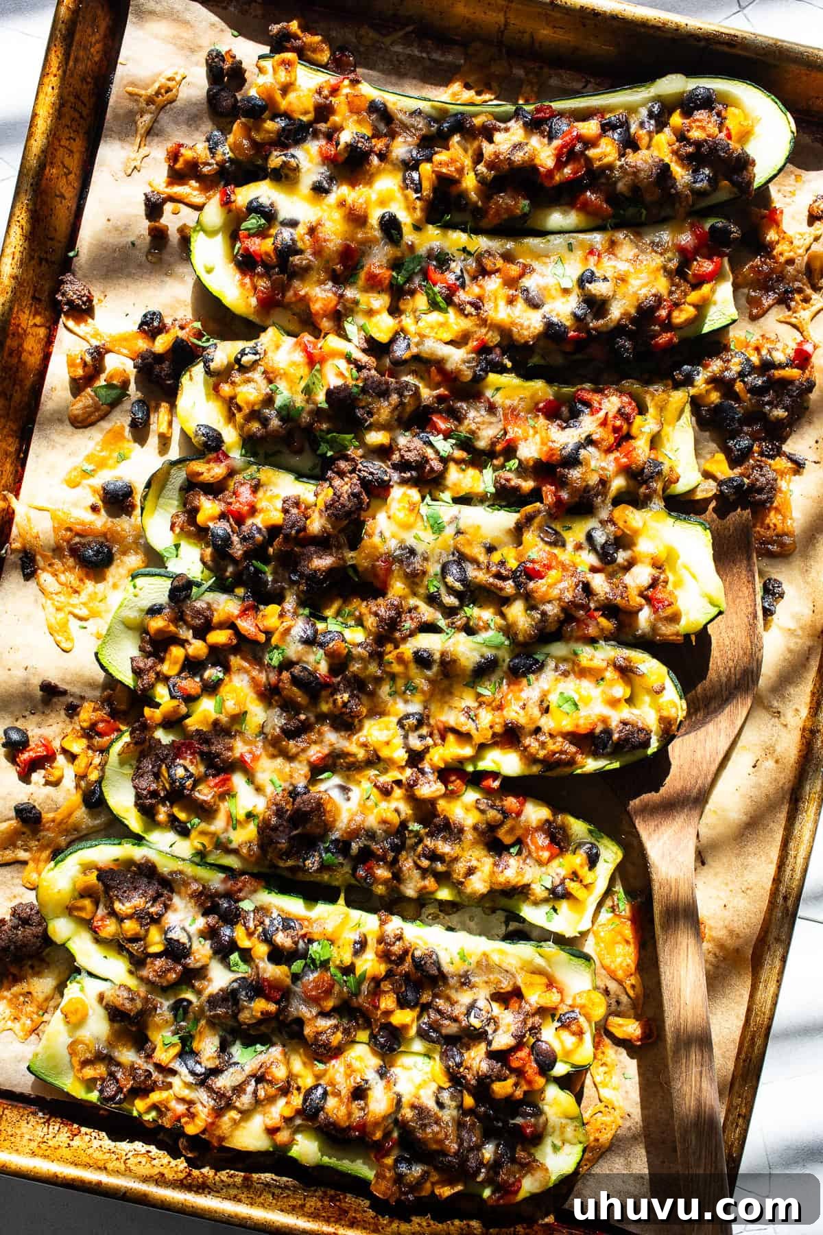 Savory Zucchini Delights 8 Stuffed zucchini boats filled with black beans, corn, cheese, and salsa.