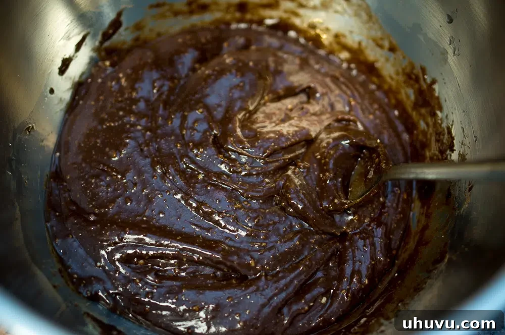 Melting the wet ingredients for no-bake chocolate bites in a pan.