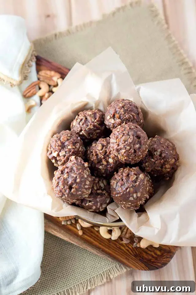 Close-up of a stack of healthy No Bake Chocolate Bites, ready to be enjoyed.