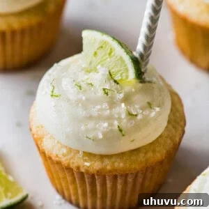 Margarita cupcakes topped with cream cheese frosting.