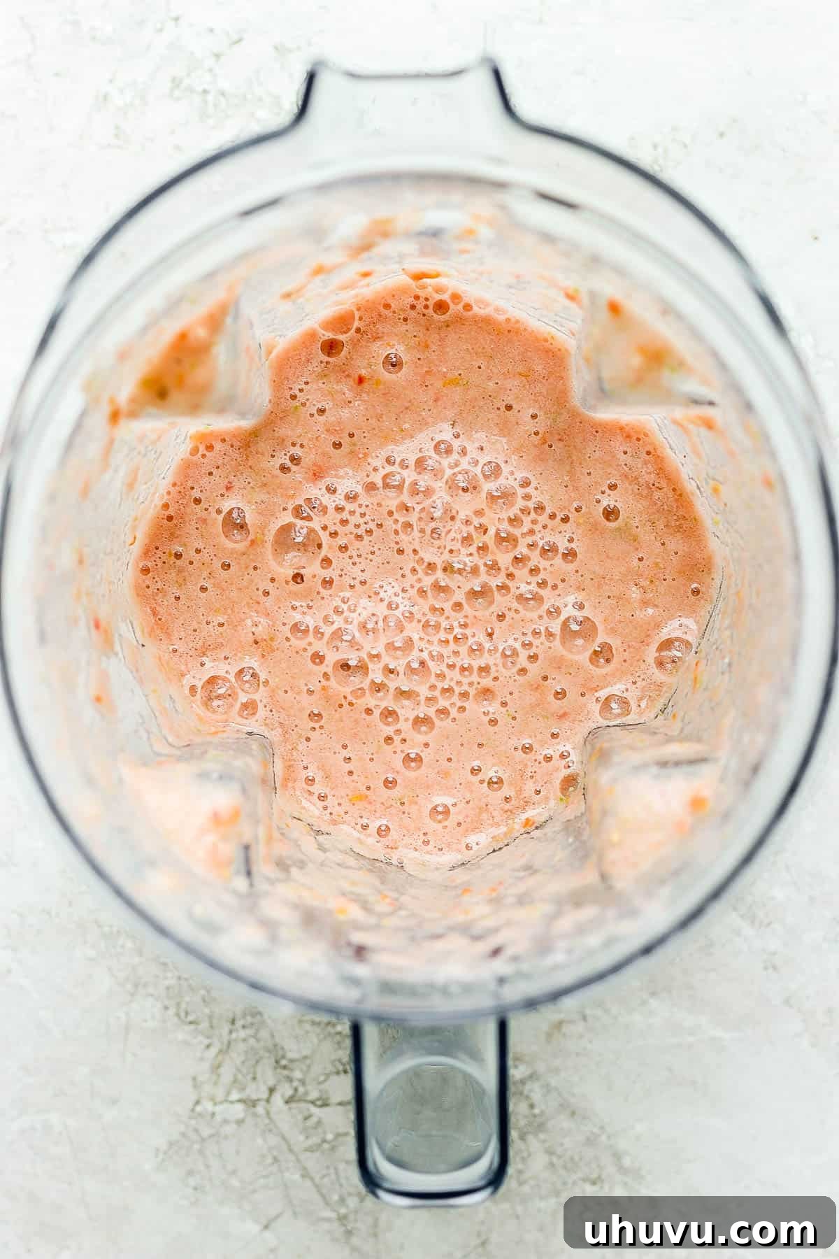 Classic Mexican Beef Hash 5 Smooth, blended tomato sauce for picadillo in a blender, ready to be added to the cooked meat and vegetables.