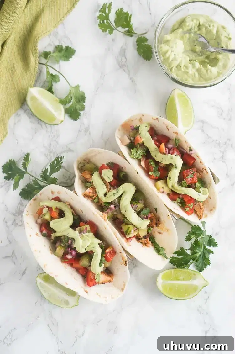 salmon tacos with salsa and avocado crema