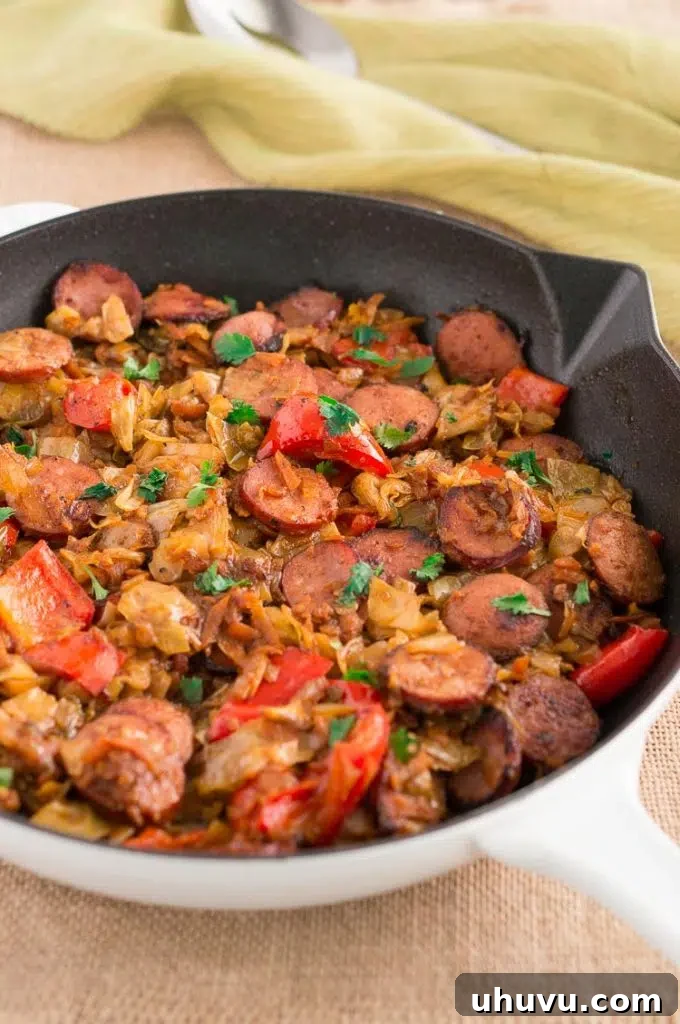 Hearty Cabbage and Sausage Skillet, garnished with fresh herbs
