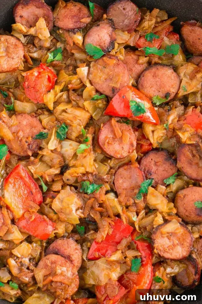 Cabbage and Sausage with peppers, onions and garnished with parsley