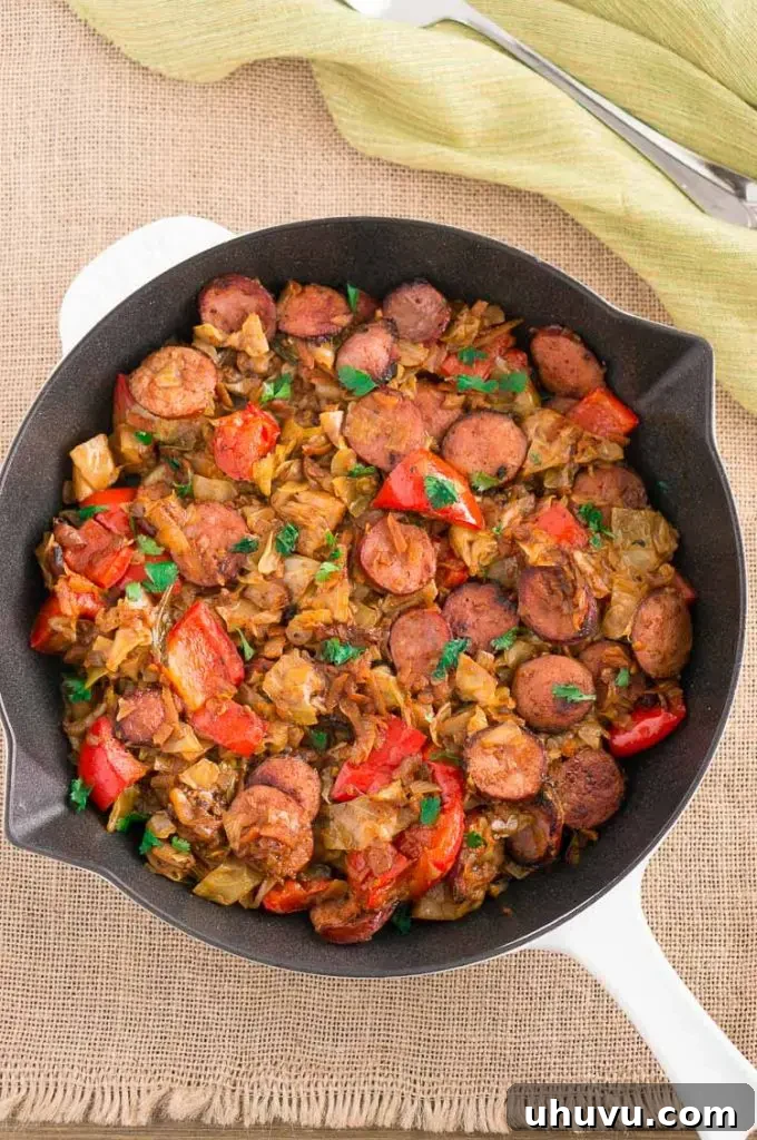 Cabbage and Smoked Sausage recipe with vegetables served in a skillet