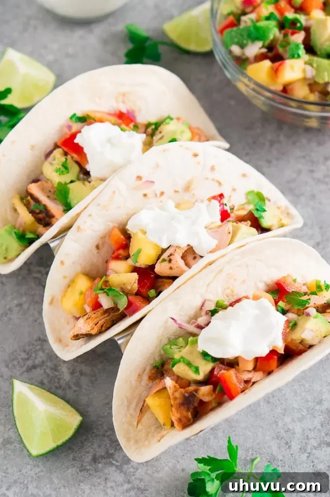 Close-up of salmon tacos with pineapple salsa and Greek yogurt
