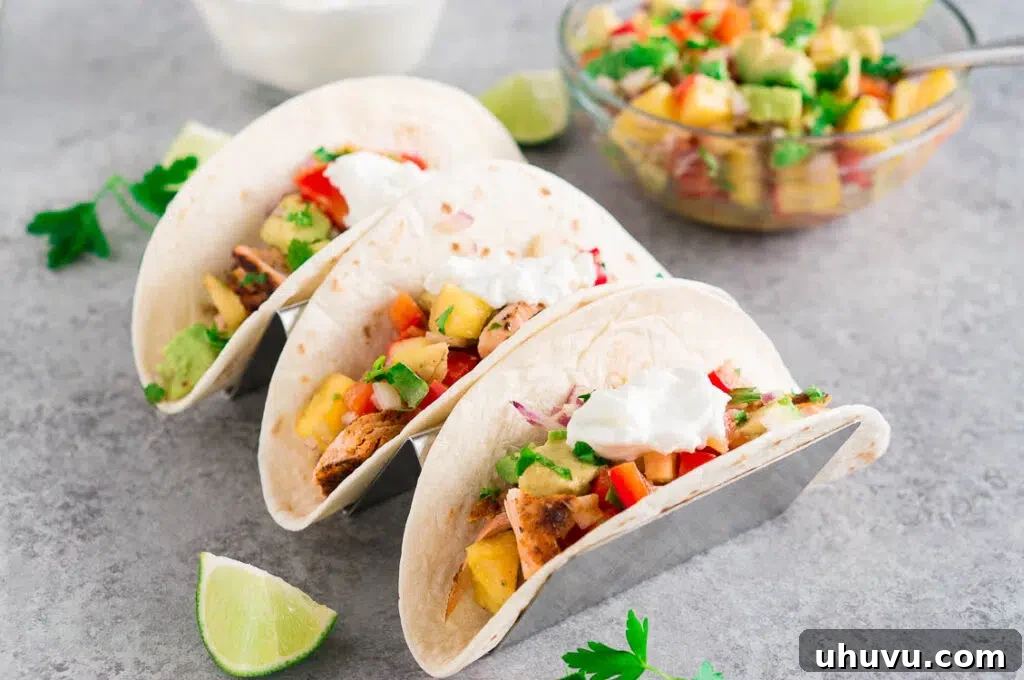 Fish Tacos with pineapple avocado salsa served on a plate