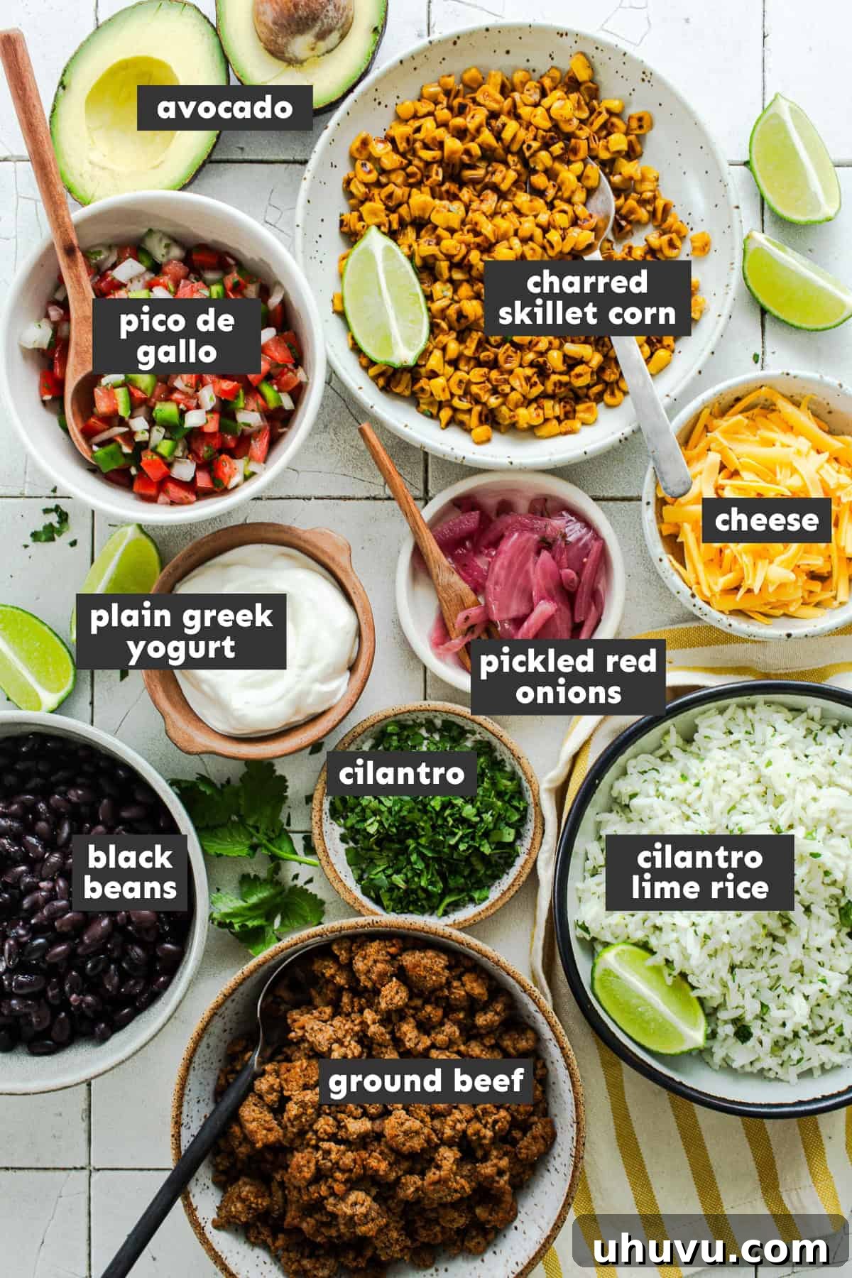 Ingredients in healthy taco bowls on a table.