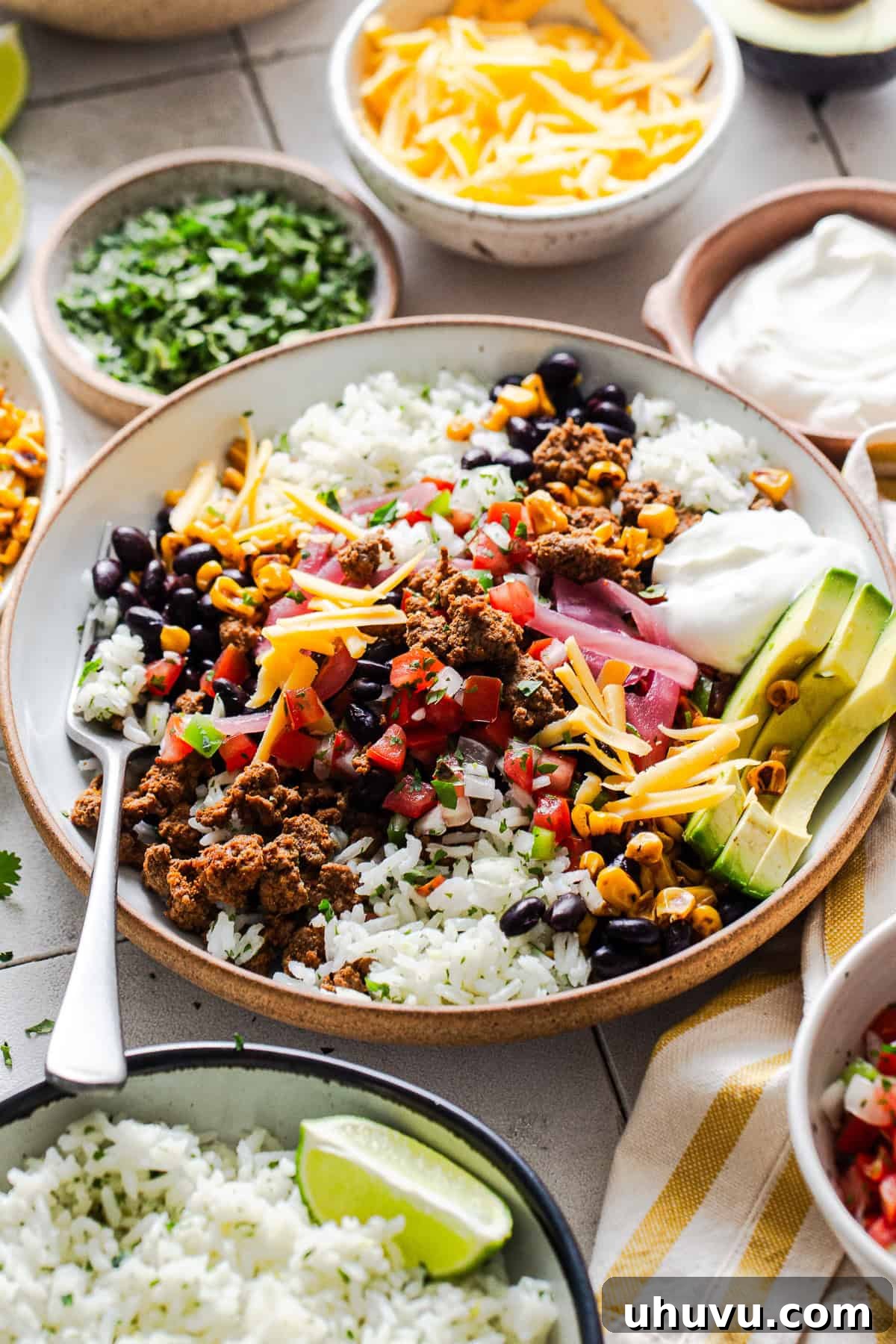 A healthy high protein taco bowl fully assembled and ready to eat.