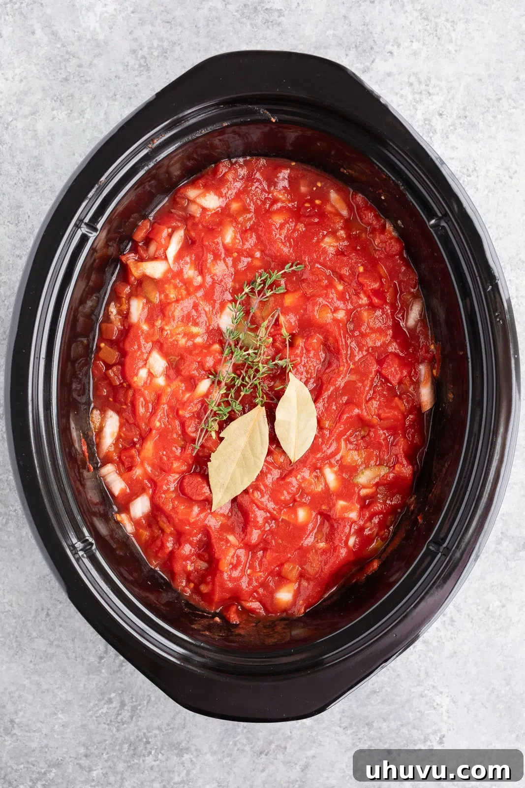 making ragu sauce in the slow cooker