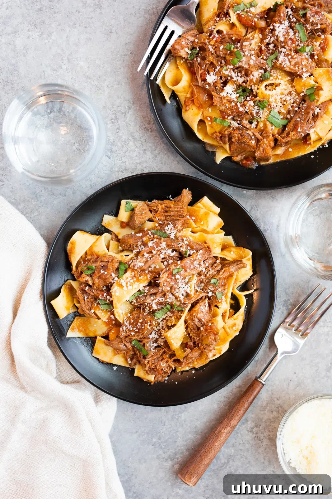 plates with tender beef ragu and pappardelle pasta