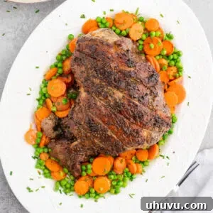 Roasted lamb leg with garlic, rosemary, and thyme served with vegetables and mashed potatoes