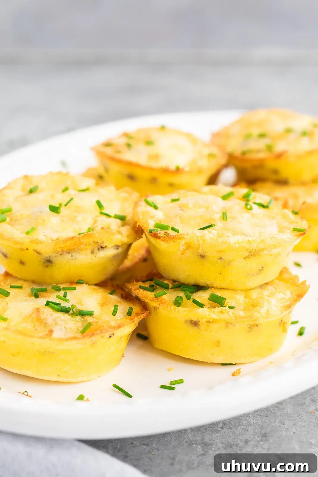 stacked egg muffins on a plate