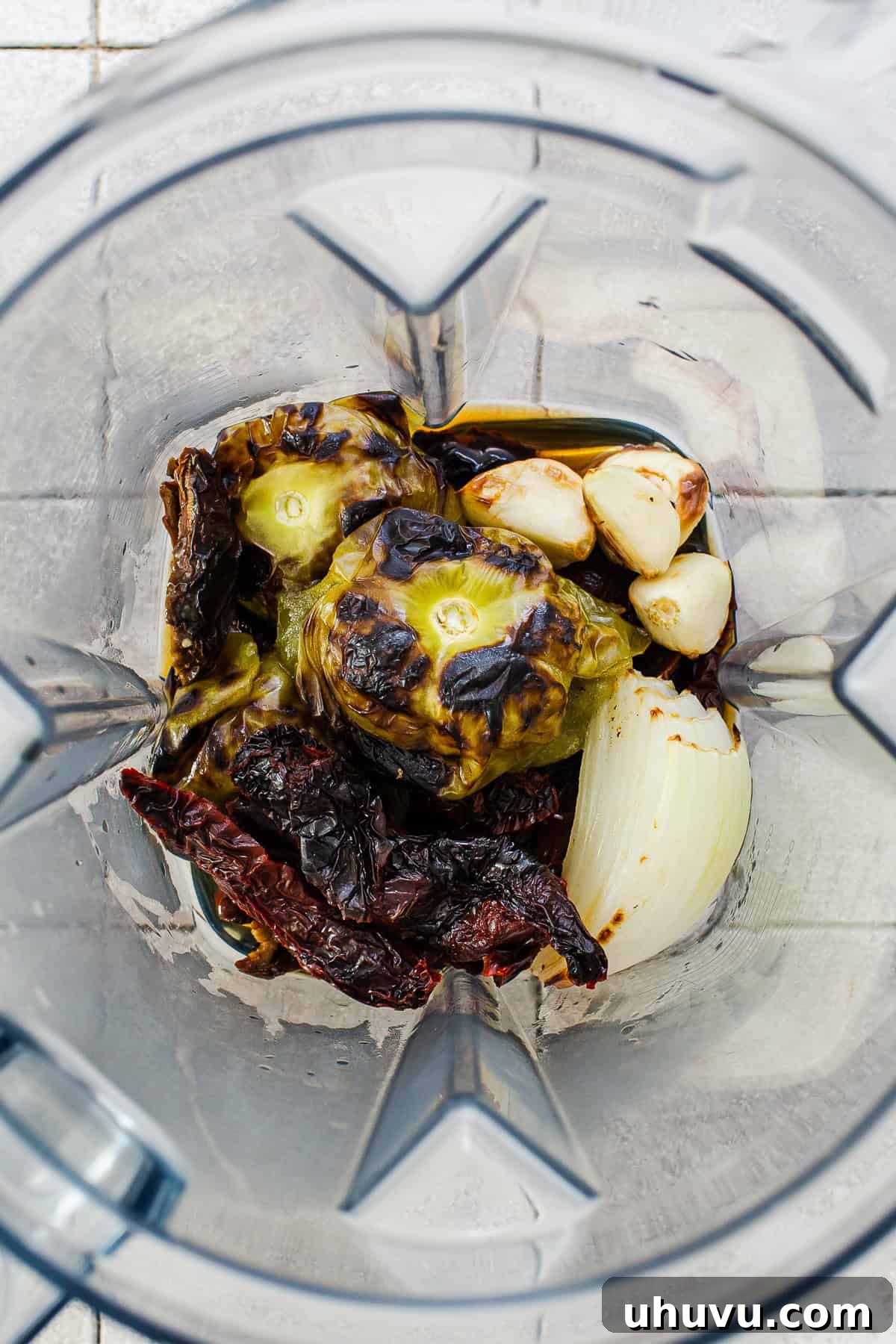 All the roasted and charred ingredients for the Salsa Morita in a blender, ready for blending.