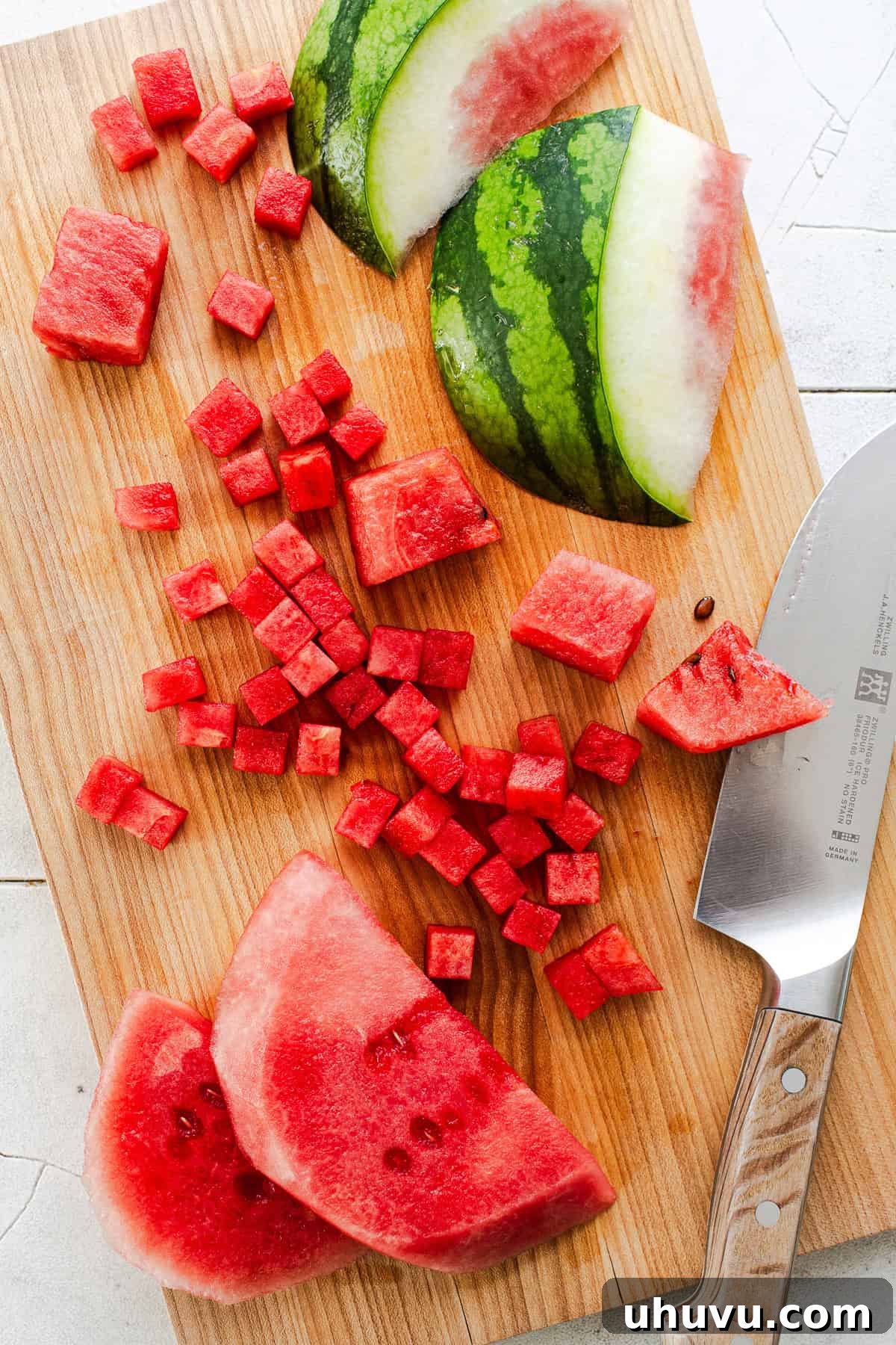 Refreshing Watermelon Salsa with Lime and Cilantro 5 Chopped watermelon on a cutting board for making watermelon salsa.