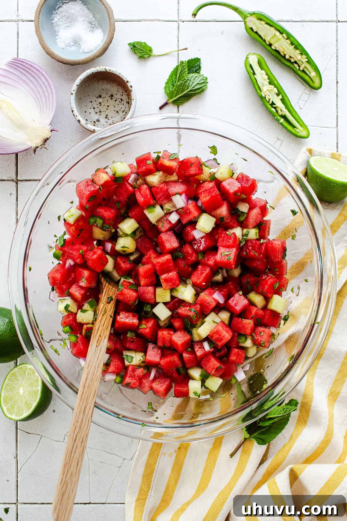 Refreshing Watermelon Salsa with Lime and Cilantro 7 Watermelon salsa tossed together in a bowl with lime and mint.