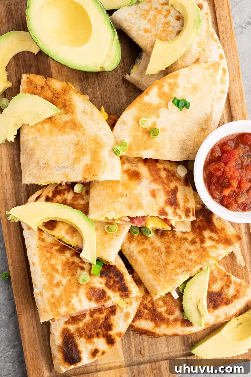 Cheesy Breakfast Quesadillas with Eggs and Salsa 9 sliced bacon and egg quesadillas with salsa